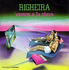 Righeira wearing white shorts and sunglasses.