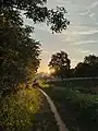 The road is next to the lake