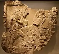 King Iddin-Sin of the Kingdom of Simurrum, holding an axe and a bow, trampling a foe. Circa 2000 BCE. Israel Museum