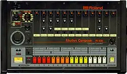 The TR-808 front panel: a black box with rows of colored buttons and dials.