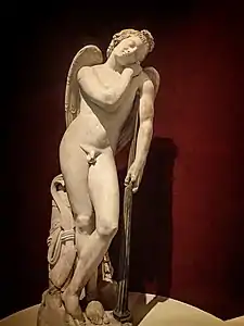 Roman statue of Eros, 100-200 CE depicting Eros sleeping,  his torch turned down, a symbol of death used in many Roman memorials.