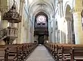 Inside view towards the pipe organ and the rose window