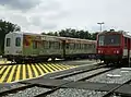 X2234 at Sarlat station with a trailer next to it.