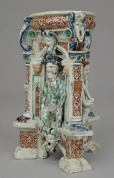 Saint-Porchaire ware, Triangular salt, 1540s?, 6 7/8 in. (17.5&nbsp;cm) high, with a (?) satyr, and (?) Venus at right.