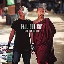A photo of two twin teenage boys, one is smoking, and the other is wearing a red robe.