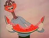dark-skinned man eating watermelon.