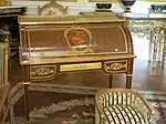Louis XVI style roll-top desk of Marie-Antoinette; by Jean-Henri Riesener; 1784; oak and pine frame, sycamore, amaranth and rosewood veneer, bronze gilt; 103.6 x 113.4&nbsp;cm; Louvre
