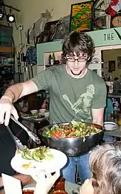 Serving food at soup kitchen in Little Grill CollectiveMay 23, 2008