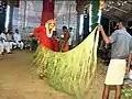Channel/medium tying the siri&nbsp;— palm leaves skirt around his waist