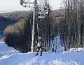 Ski lifts and slopes covered with natural snow.
