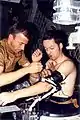 Weitz assists Kerwin with a blood pressure cuff