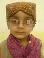 Sindhi hat with Ajrak designs. Scarf with bandhani prints