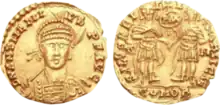 Solidus of Anthemius - RIC X 2804. AD 467-472. Rome mint. Struck AD 471-472. D N ANTHEMI-VS P F AVG, pearl-diademed, helmeted, and cuirassed facing bust, holding spear in right hand, on left arm a shield decorated with horseman motif / SALVS REI-P-V-BLICAE, Anthemius and Leo I, holding Victory on globe in right hand, standing facing, clasping hands; between them PAX within wreath surmounted by cross; R-M//COMOB.