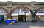 Site of the old station booking office; the bricked-up ticket windows are still visible