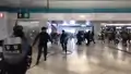 Special Tactical Squad run into Yuen Long Station concourse on July 27 2019