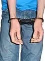 Cuffs applied in front in the palm to palm position