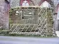 St Bees Priory, Cumbria: Squint window in the wall of chapel built 1270–1300. Window is infilled, but outline is shown, and cross hatch shows wall and floor abutments.
