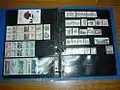 Ring-binder of loose-leaf stock pages storing stamp booklets and booklet panes.
