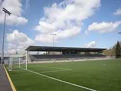 A soccer field with a single-tier grandstand