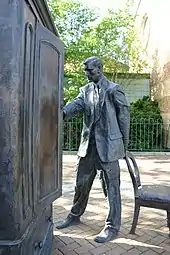 Image 20Statue of C. S. Lewis in front of the wardrobe from his Narnia book The Lion, the Witch and the Wardrobe (from Children's literature)