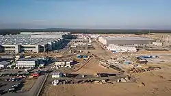 Giga Berlin-Brandenburg under construction in Grünheide, on the left edge of the Berliner Ring, with the Freienbrink industrial park in the back
