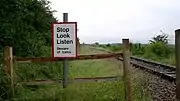Stop Look Listen Beware of Trains sign near Fenny Compton Junction. This crossing is a foot crossing, one of the most common in the United Kingdom