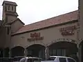 A strip-mall in the Mahatma Gandhi District - The Olympic Center with ample Indian and Pakistani retail shops and restaurants.