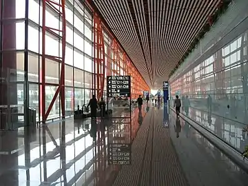 Sign displaying gate locations in Terminal 3 of PEK