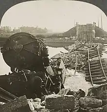 B&W photo of a train in a river