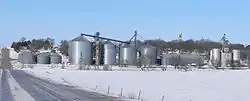 Tarnov seen from the east. In the foreground are grain bins along the Nebraska Central Railroad track; on the hill right of center is the steeple of St. Michael's Catholic Church.