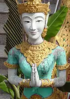 Statue with namaste pose (wai) in a Thai temple