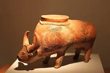 Vessel in the form of a water buffalo from Lopburi; 2300 BC; ceramic; height: 18 cm (7.mw-parser-output .frac{white-space:nowrap}.mw-parser-output .frac .num,.mw-parser-output .frac .den{font-size:80%;line-height:0;vertical-align:super}.mw-parser-output .frac .den{vertical-align:sub}.mw-parser-output .sr-only{border:0;clip:rect(0,0,0,0);clip-path:polygon(0px 0px,0px 0px,0px 0px);height:1px;margin:-1px;overflow:hidden;padding:0;position:absolute;width:1px}3⁄32 in.)