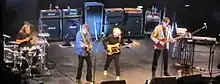 The band performing on stage