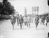 1917 Official visit to the Western Front, with leaning virgin in the background