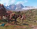 Mountainous landscape with a seated man and two donkeys