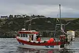 Fishing boat "shooting" a line of creels