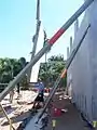 Panel being hoisted into position.