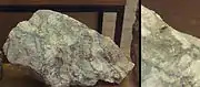 Toi ore with visible gold specks (30g of gold and 250g of silver per ton).