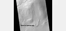Tongue-shaped glacier, as seen by HiRISE under the HiWish program.  Ice may exist in the glacier, even today, beneath an insulating layer of dirt.