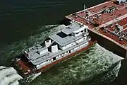Towboat Ben McCool upbound on Ohio River at Matthew E. Welsh Bridge with two tank barges (4 of 6), near Mauckport, Indiana, USA, 1987