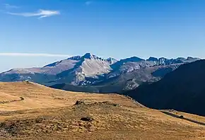 A color image of a rock at the foot of a large mountain