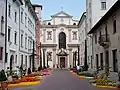 Chiesa di San Francesco Saverio (St. Francis Xavier Church). The street is via Belenzani connecting the church facade with Piazza Duomo