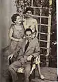 George Fteris (sitting) with his wife Rhea (left) and daughter Elyana