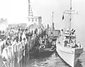 CG-262 with seized tug Elcisco and barge Redwood City docked in San Francisco Harbor, 1927.