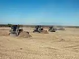 Marine Wing Support Squadron 374 heavy equipment operators remove dirt from and level an unmanned aircraft system runway at the Chocolate Mountain Aerial Gunnery Range (2009)