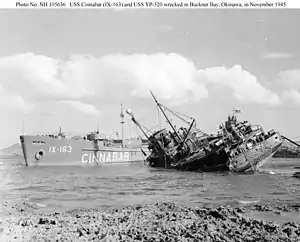 USS Cinnabar (IX-163) and USSYP-520 damaged in Typhoon, in Buckner Bay