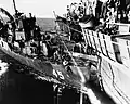 USS Lee Fox (APD-45) after colliding with USS Gilbert Islands in 1945.