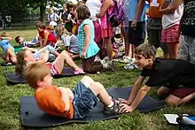 Picture of schoolchildren doing sit-ups