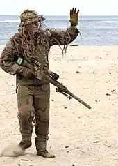 Navy SEALs sniper with MK 11.