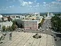 View of the monument on the Sophia Square (Sofiiska Ploshcha), behind it the "Prisutstvinyie mesta" building